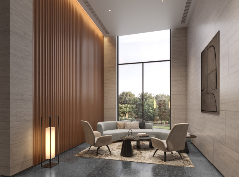 A spacious waiting area with comfortable seating and large windows overlooking a garden._brandestate.in